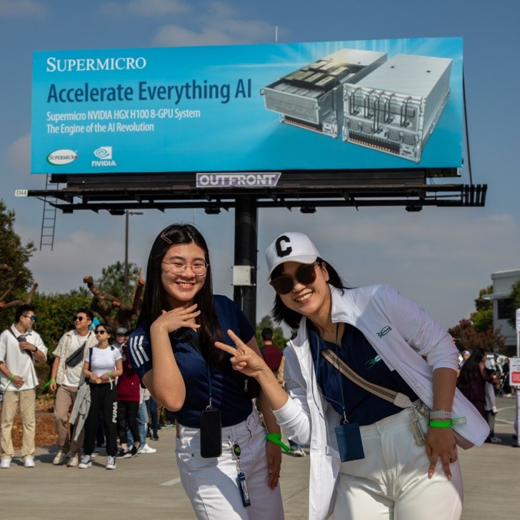 Supermicro employees plus “Accelerate Everything AI” Billboard @ 30th Anniversary celebration